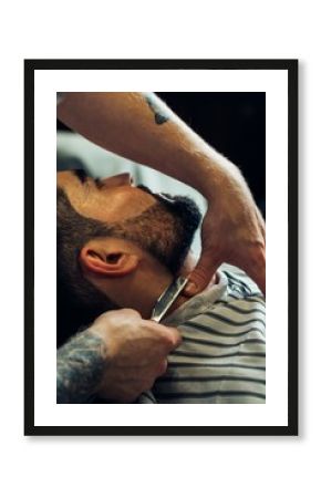 Man having a shave at the barber shop.