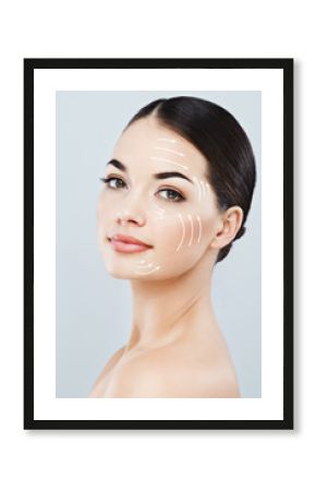 Gorgeous girl with dark hair at gray studio background