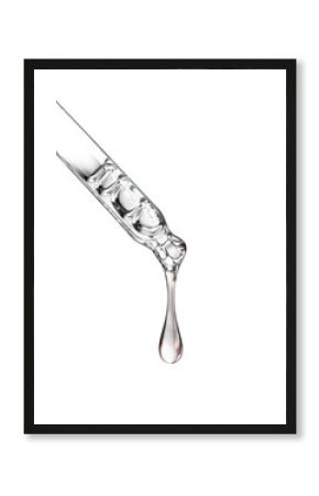 Cosmetic pipette with a drop close up on white background