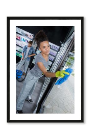 beautiful woman wearing apron for cleaning window