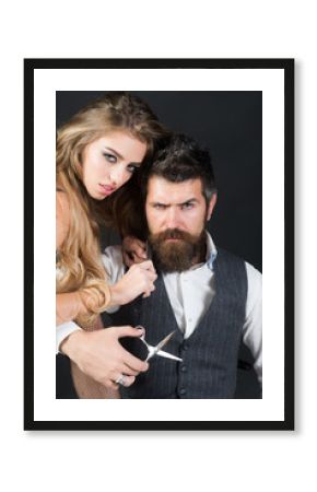 Bearded man and sexy woman with long curly hair.