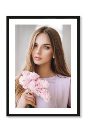 beautiful girl in a gentle pink dress