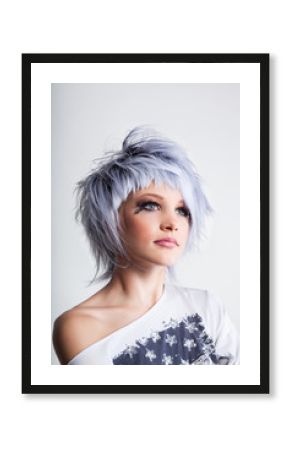 Beauty girl in a short haircut with blue hair