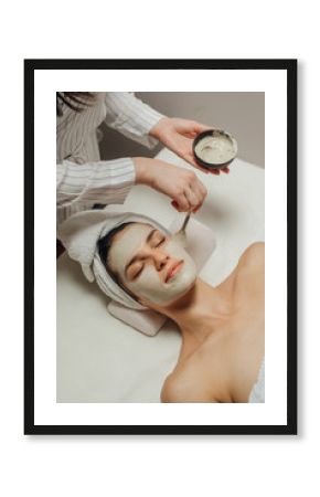 Cosmeotologist Applying a Facial Mask