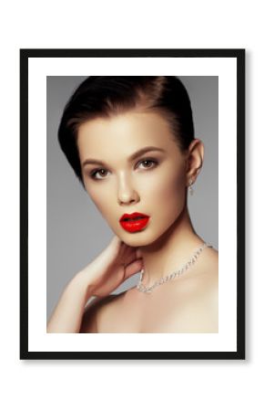 Beautiful girl with set jewelry. Woman in a necklace with a ring, earrings, crown. Accessories. Fashion portrait of young woman with jewelry and elegant hairstyle. Perfect makeup. Beauty style model