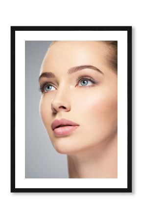 Beautiful face of young woman with perfect skin