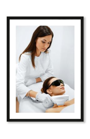 Skin Care. Young Woman Receiving Facial Beauty Treatment, Removing Pigmentation At Cosmetic Clinic. Intense Pulsed Light Therapy. IPL. Rejuvenation, Photo Facial Therapy. Anti-aging Procedures.