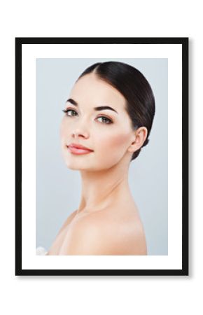 Gorgeous girl with dark hair at gray studio background