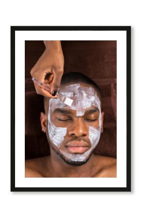 Face Mask Applied To Young Man