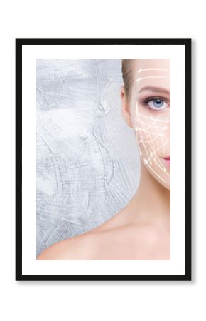 Beautiful and young woman over the grey background. Healthy skin