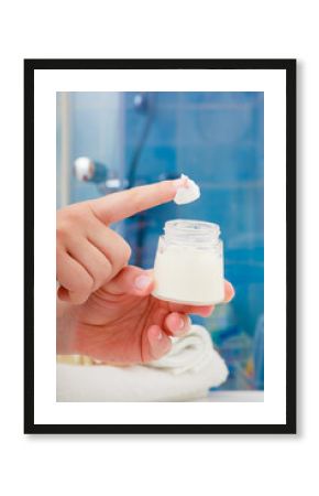 Moisturizing cream in female hands