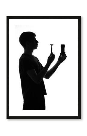 young man with an electric razor