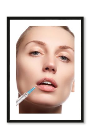 Portrait of young woman getting cosmetic injection. Closeup of beautiful woman gets injection in her face. Filler injections. Lip augmentation. Beautiful perfect lips