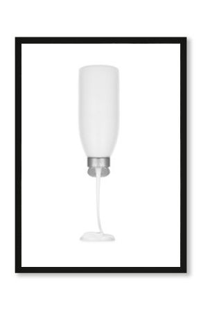 white cream flows from cosmetic tube on white background