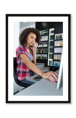 woman checking disponibility in computer for phone appointment