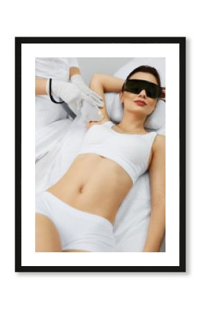 Beautician Doing Laser Hair Removal Treatment On Armpits