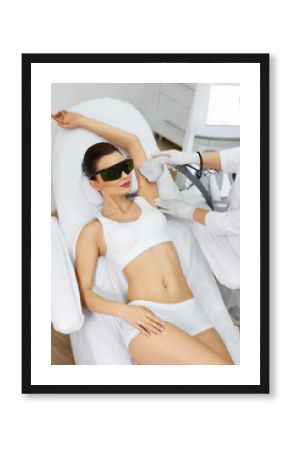 Beautician Doing Laser Hair Removal Treatment On Armpits