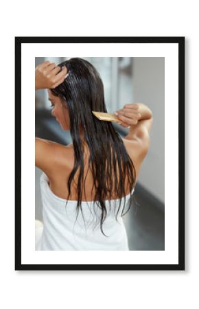 Beautiful Woman Putting Mask On Long Wet Hair. Hairbrushing