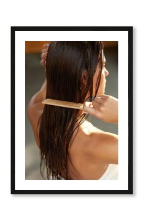 Beautiful Woman Hairbrushing Her Long Wet Hair. Hair Care