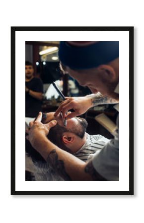 Man having a shave at the barber shop.