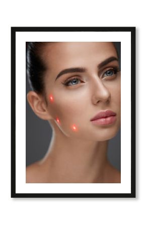 Closeup Of Beautiful Woman Face With Laser Points On Facial Skin