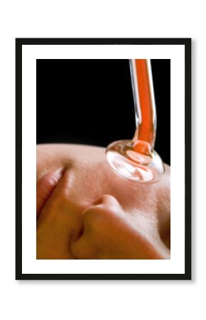 Beauty treatment of face skin with high frequency infrared spot remover in SPA center