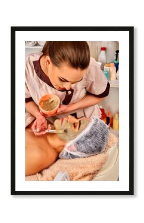 Collagen face mask. Facial skin treatment. Face of woman of elderly woman 50-60 years old receiving cosmetic procedure in beauty salon close up. Mask of natural ingredients.