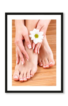 Closeup shot of female legs and hands with clean and soft skin. Skincare concept