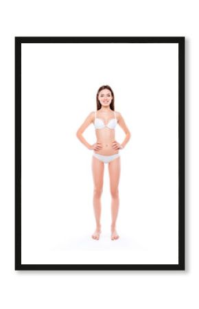 Freshness youth sensual sensitive sportive clean clear purity vertical full-length portrait of stunning beautiful sporty girl keeping hands on waist line standing straight isolated on white background