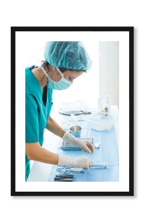 Doctor with many kind of medical equipment manage for to start operation in operating room.