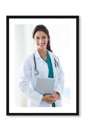 Beautiful young female doctor looking at camera in the office.