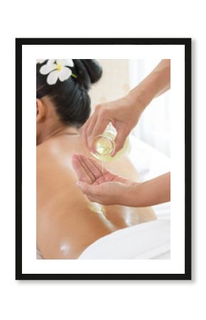 woman lying down on a massage bed at a spa