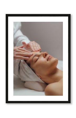 Woman Enjoying a Facial Massage