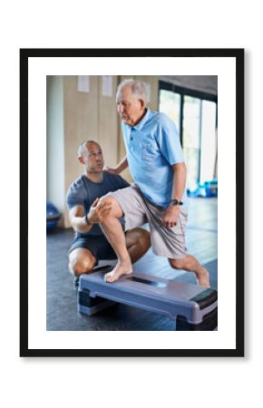 Recuperation is hard work. A trainer helping an elderly man with fitness.