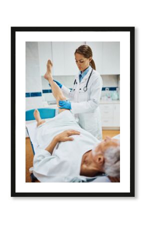Female doctor examining senior patient's leg at orthopedic clinic.