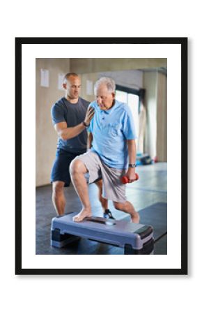 Its not easy, I know. Cropped shot of a handsome personal trainer with a senior man.