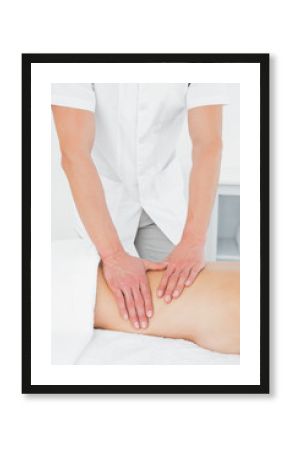 Close-up of a physiotherapist massaging woman's back