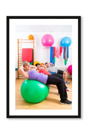 Patients at physiotherapy on training balls