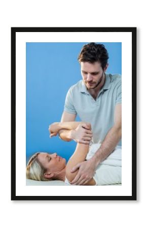 Woman receiving shoulder therapy from physiotherapist