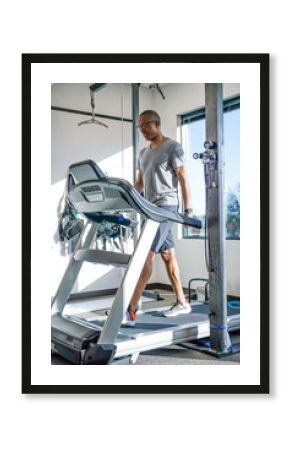 Man walking on treadmill in clinic