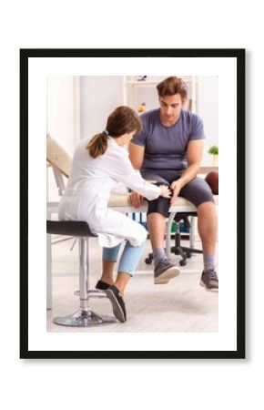 Handsome american footbal player visiting female doctor traumato