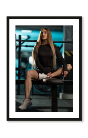 fitness enthusiast is stretching on bench in gym focusing on flexibility and balance. energetic atmosphere reflects commitment wellness and fitness goals.