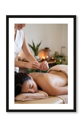 Relaxed woman receiving holistic acupuncture therapy for back pain and wellness from skilled acupuncturist 