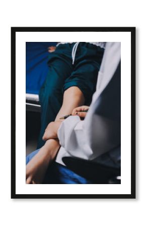 Rehabilitation therapy Professional male physiotherapists working in rehabilitation centers while treating male patients with leg and muscle pain.