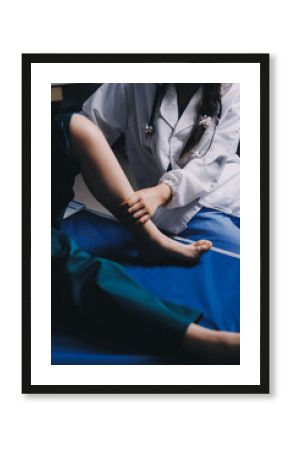 Rehabilitation therapy Professional male physiotherapists working in rehabilitation centers while treating male patients with leg and muscle pain.