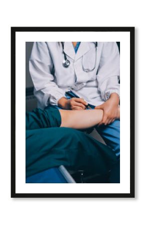 Rehabilitation therapy Professional male physiotherapists working in rehabilitation centers while treating male patients with leg and muscle pain.