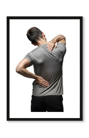 A man wearing a gray t-shirt and black pants, standing with his back to the camera is holding his back in pain, isolated over transparent background, PNG cut-out