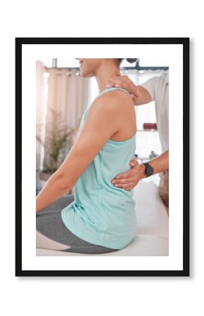 Chiropractor, physiotherapy and back pain of woman while at physiotherapist for a massage, physical therapy and healing. Therapist with client at health and wellness chiropractic spa for consultation