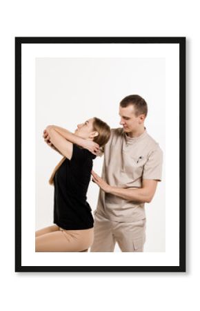 Manual therapy at physiotherapist or chiropractor. Orthopedist examining female neck and head. Manual correction of the ridge and cervical region. Rehabilitation therapy on white background.