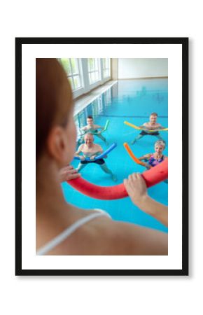 People in aqua fitness class during a physical therapy session in a physiotherapy center